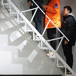 Folding Stairs Against Wall: Space-Saving Solution
